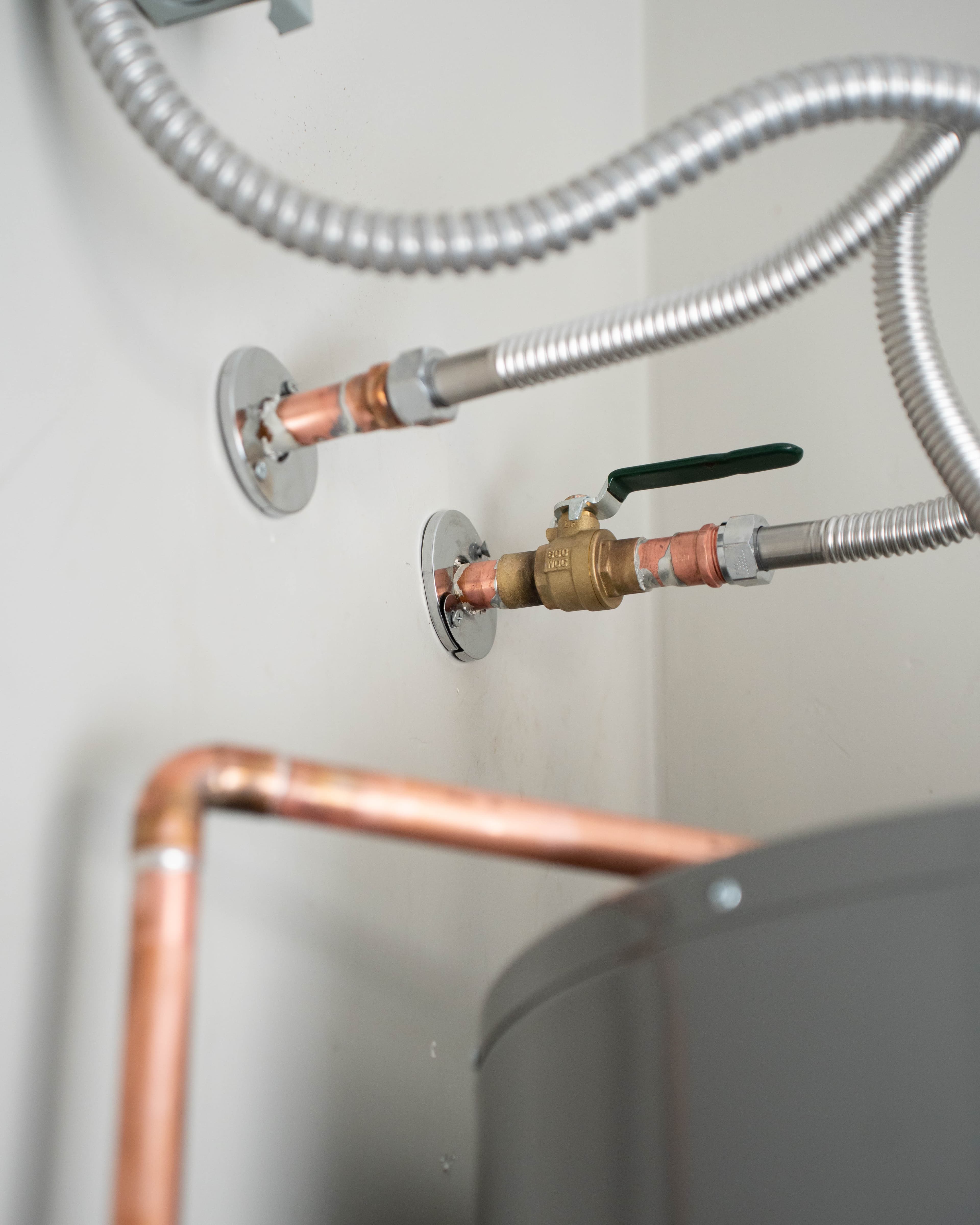 Call-Us Plumbing technician working on a Phoenix water heater